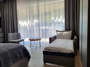 VISLOW Resort客房内的一张或多张床位