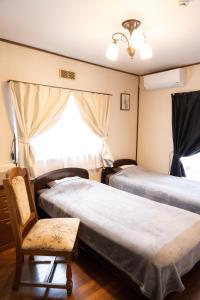 Postel nebo postele na pokoji v ubytování 一組貸切宿 岡村 弐番館 limited to 1group per day 一棟まるまる貸切