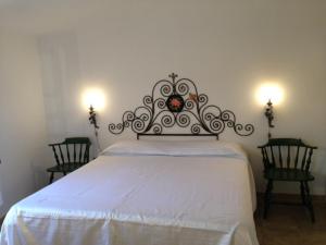 A bed or beds in a room at Appartamento Caty