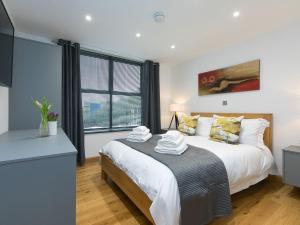 Una cama o camas en una habitación de Nova Cottage