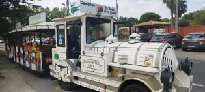 a small golf cart with people riding in it at Le mobilhome de Maelya in Saint-Cyprien +2 photos