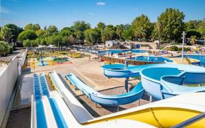 a water park with a bunch of water slides at Le mobilhome de Maelya in Saint-Cyprien