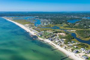 an aerial view of the shoreline of a beach at Walk2beach, Hottub, Firepit, Petsok in Dennis