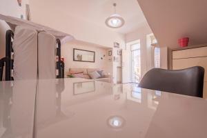 a living room with a glass table and a couch at Casa Bottazzi in Diso