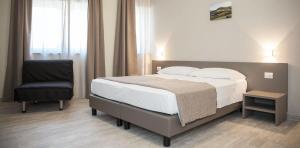 Posteľ alebo postele v izbe v ubytovaní Hotel & Wellness Stella Delle Langhe