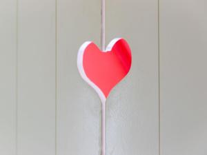 a heart shaped lollipop hanging on a wall at Holiday Home Buitenplaats Gerner-7 by Interhome in Dalfsen