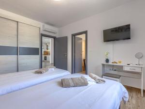 Postel nebo postele na pokoji v ubytování Holiday Home Villa Veli vrt by Interhome