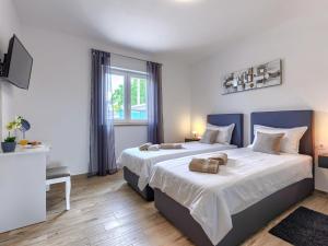 Postel nebo postele na pokoji v ubytování Holiday Home Villa Veli vrt by Interhome