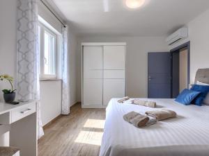 Postel nebo postele na pokoji v ubytování Holiday Home Villa Veli vrt by Interhome