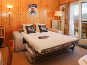 Ένα ή περισσότερα κρεβάτια σε δωμάτιο στο Apartment Belmont Ouest 75 by Interhome