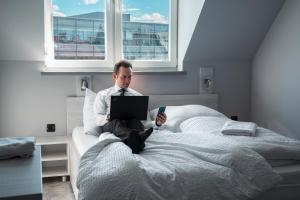 Postel nebo postele na pokoji v ubytování Do Step Inn Meidling - Self-Service-Hotel