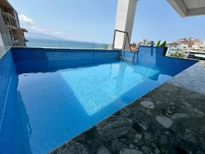 Bazén v ubytování DREAM HOTEL SARANDA nebo v jeho okolí