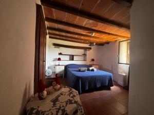 Postel nebo postele na pokoji v ubytování Terrazza sul Tufo