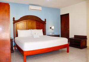 Hotel Quinta Izamal客房内的一张或多张床位