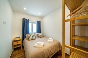 Ένα ή περισσότερα κρεβάτια σε δωμάτιο στο Casa Estrela do Mar