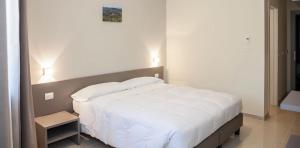 Posteľ alebo postele v izbe v ubytovaní Hotel & Wellness Stella Delle Langhe