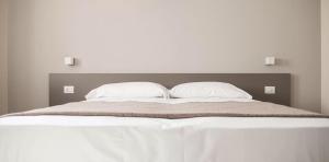 Posteľ alebo postele v izbe v ubytovaní Hotel & Wellness Stella Delle Langhe