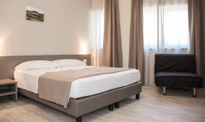 Posteľ alebo postele v izbe v ubytovaní Hotel & Wellness Stella Delle Langhe