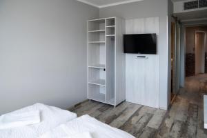TV a/nebo společenská místnost v ubytování Do Step Inn Meidling - Self-Service-Hotel