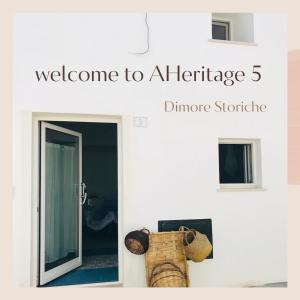 a sign that reads welcome to a heritage dinore stichride next to at AHeritage 5 in Marittima