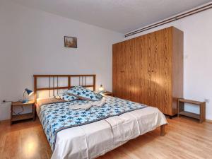 Łóżko lub łóżka w pokoju w obiekcie Holiday Home Jakov by Interhome