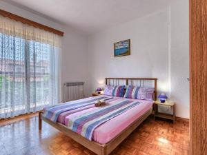 Łóżko lub łóżka w pokoju w obiekcie Holiday Home Jakov by Interhome