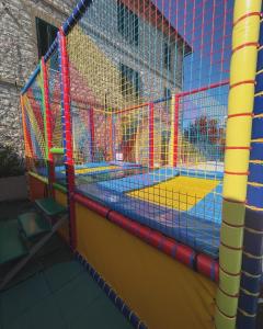 a large play area with a bounce house at Il Casale Appartamento Assisi in Assisi