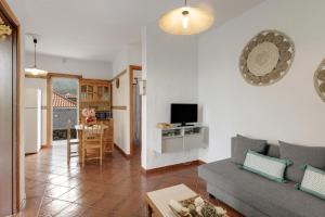 a living room with a couch and a table at La Casa Amarilla in El Paso