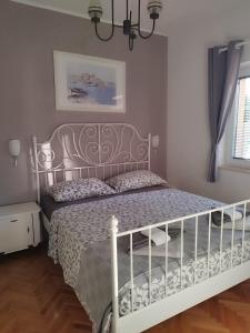 Postel nebo postele na pokoji v ubytování Apartments Merlin