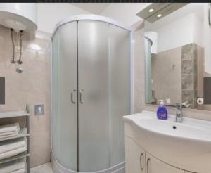 a bathroom with a shower and a sink at Two Bedroom Apartment Sonja with Seaview in Punat
