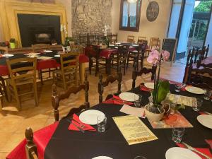 a dining room with tables and chairs in a restaurant at Nuova Scardua Agr Cucina Tipica in Cavriana +72 photos