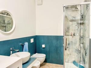 a bathroom with a toilet and a shower at Apartment DaNina by Interhome in Abbadia Lariana