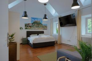Postel nebo postele na pokoji v ubytování BRIDGE apartments