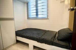 Katil atau katil-katil dalam bilik di Rendez-vous 2BR Condo Unit at SMDC Cheer