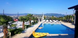 a large swimming pool with a large yellow inflatable raft at hotel Labyrinth pool in Tbilisi City