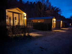a house with lights on the side of it at night at Haus Silva in Stuer