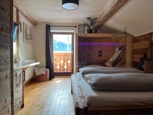 Posteľ alebo postele v izbe v ubytovaní Apart Hansler "das Liara" mit Infrarotkabine und Balkon