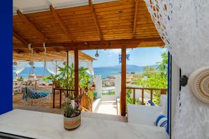 a view of the ocean from the balcony of a house at Korali Sea House in Archangelos