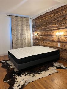 Posteľ alebo postele v izbe v ubytovaní Gîte Ranch Le Serpolet
