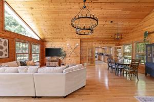 a living room with a couch and a table at Torch Lake House Central Lake in Central Lake