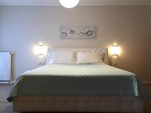 Ein Bett oder Betten in einem Zimmer der Unterkunft Exclusive Holiday Apartments