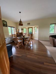 a living room with a table and chairs at The Ranch in Leitrim +17 photos