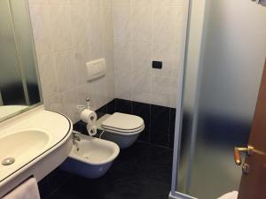 Koupelna v ubytování Hotel Confine