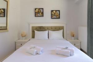 Ένα ή περισσότερα κρεβάτια σε δωμάτιο στο Therros Villa with private pool by Estia