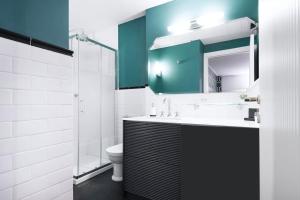 a bathroom with a sink and a toilet and a mirror at Easylife - Studio a few steps from Duomo in Milan +17 photos