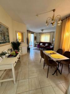 a living room with a table and a dining room at Budget-Apart Caronte in Riviera del Sol, Mijas Costa in Mijas Costa +23 photos