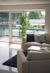 a living room with a couch and a table at Ferienwohnung Ausguck in Breege