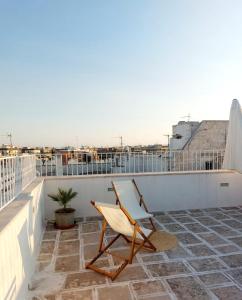 a chair on the roof of a building at Casa Vittoria Martina Franca in Martina Franca