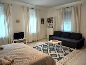 Postel nebo postele na pokoji v ubytování Kertész14 Apartman