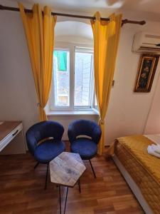 Posteľ alebo postele v izbe v ubytovaní INCHY ACCOMMODATION - in the center of Diocletian's Palace